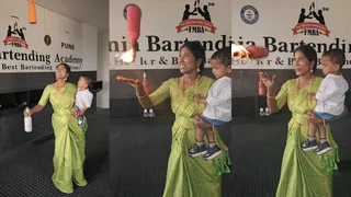 Woman Bartender Juggles Flair Bottles With One Hand While Holding Baby In Another | Viral Video